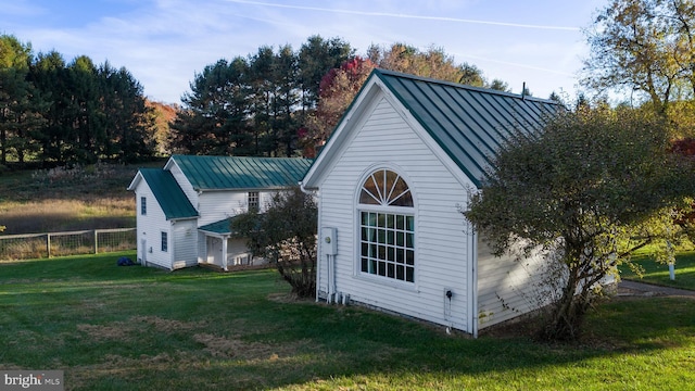 view of home's exterior featuring a yard