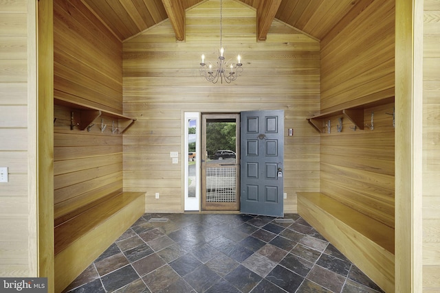 mudroom featuring wood walls, wooden ceiling, beam ceiling, and a chandelier