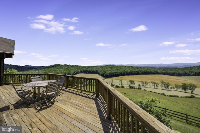 wooden deck with a rural view