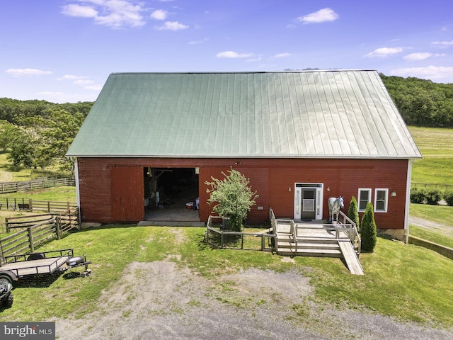 view of front of house with an outbuilding