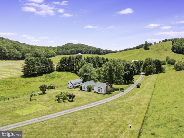 birds eye view of property with a rural view