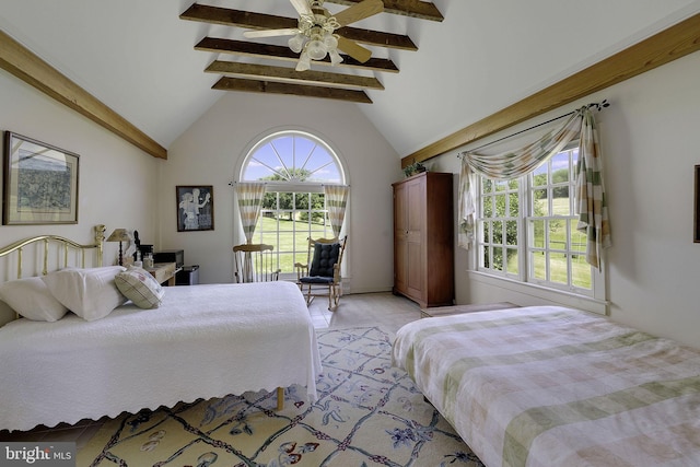 bedroom featuring vaulted ceiling with beams and ceiling fan