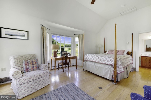 bedroom with ensuite bathroom, light hardwood / wood-style floors, lofted ceiling, and ceiling fan