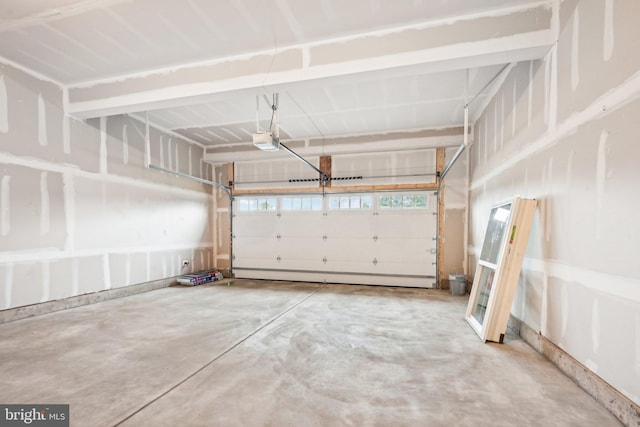 garage with baseboard heating and a garage door opener