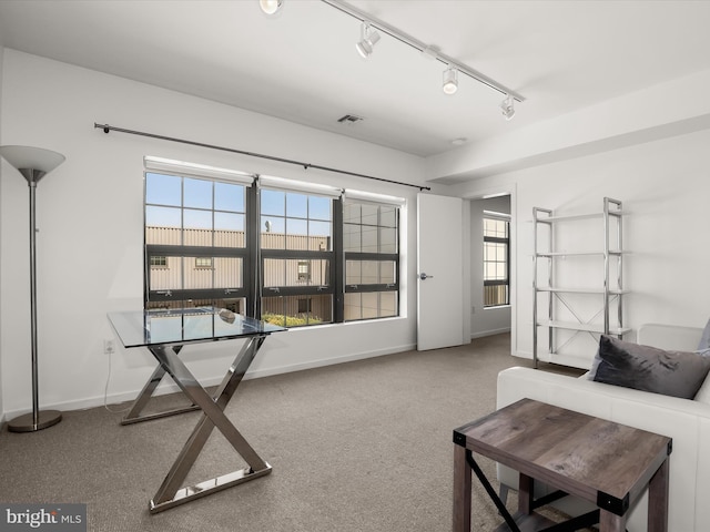 interior space with visible vents, carpet floors, and baseboards