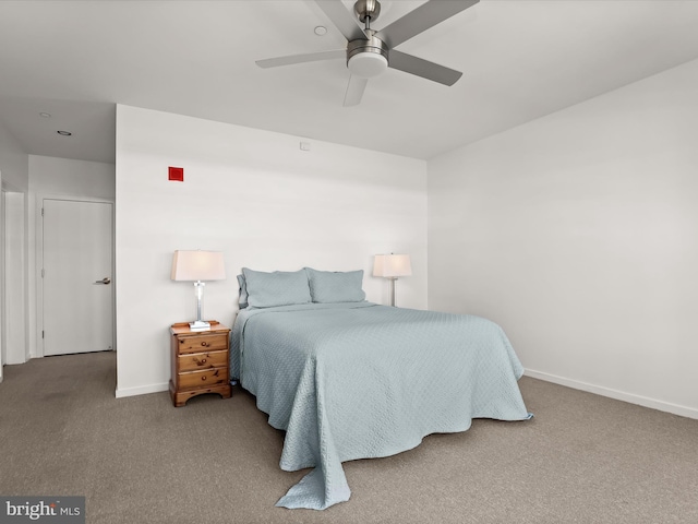 bedroom featuring ceiling fan, baseboards, and carpet