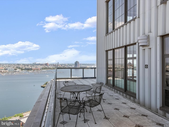 exterior space featuring a water view and a city view