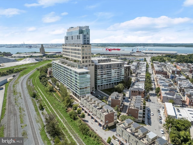 drone / aerial view with a city view and a water view