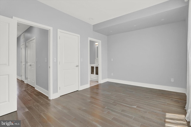 empty room with hardwood / wood-style flooring