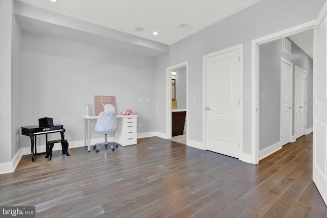 home office with hardwood / wood-style flooring