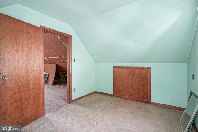 additional living space with lofted ceiling