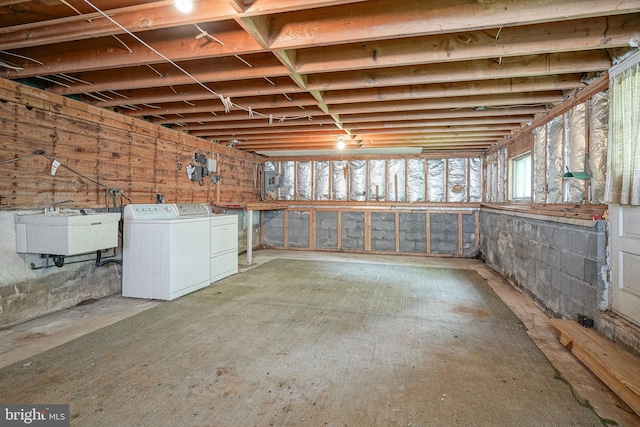 basement with washer and dryer and sink