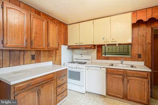 kitchen featuring sink and white appliances