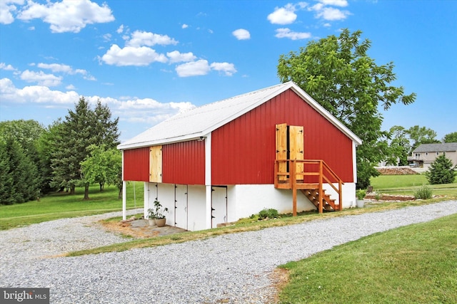 view of outdoor structure with a lawn