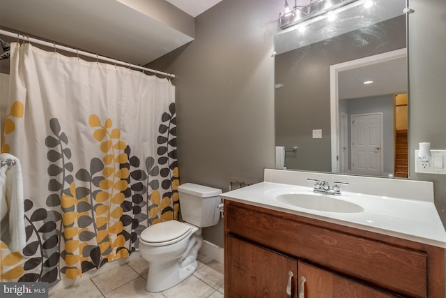 bathroom with vanity, tile patterned floors, and toilet