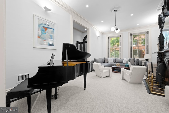 sitting room featuring carpet and crown molding