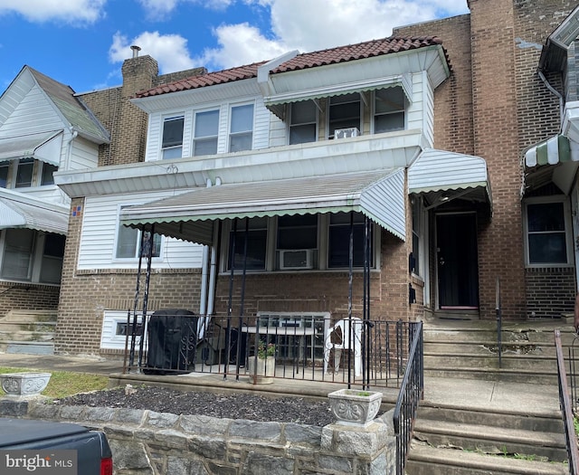 view of front of home featuring cooling unit