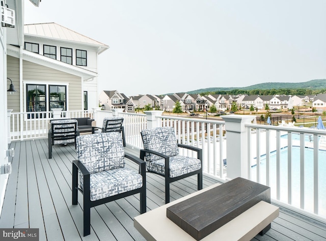 wooden deck featuring an outdoor hangout area