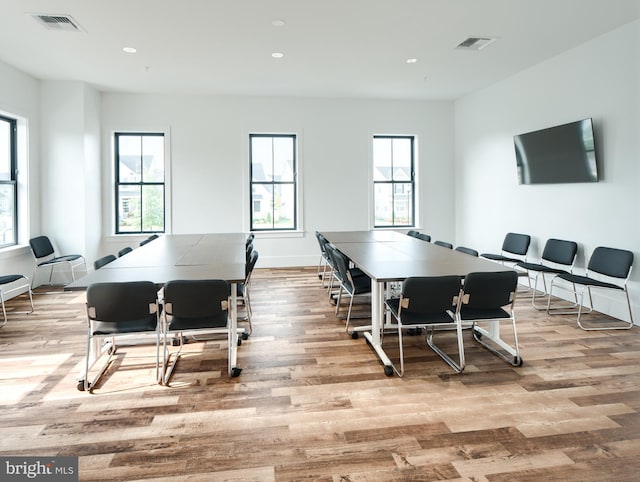 rec room with light hardwood / wood-style flooring