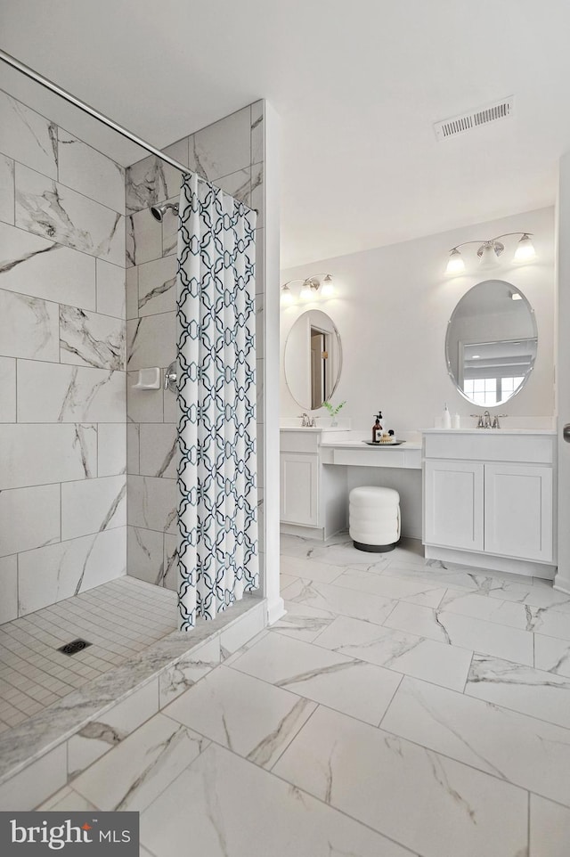 bathroom featuring vanity and a shower with shower curtain