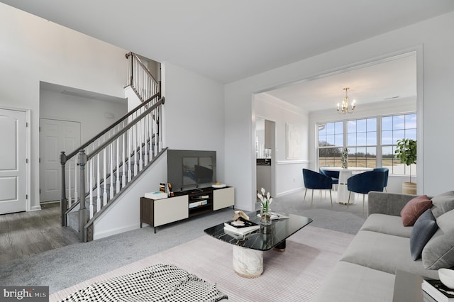 living room featuring carpet floors and a chandelier