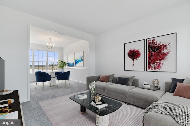 carpeted living room with an inviting chandelier