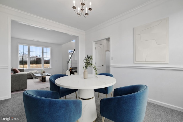 carpeted dining room with ornamental molding and a notable chandelier