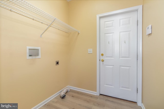 laundry room with hookup for a washing machine, light wood-type flooring, and electric dryer hookup