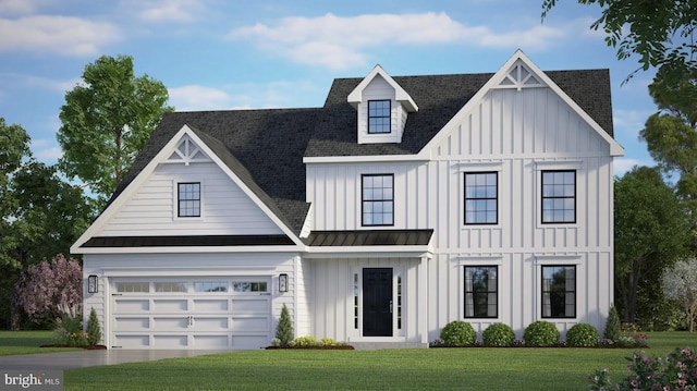 view of front of property featuring a front yard and a garage