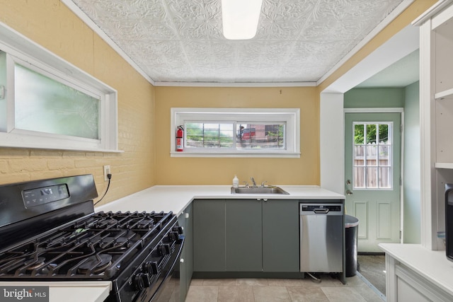 kitchen with dishwasher, gray cabinets, black range with gas stovetop, and sink