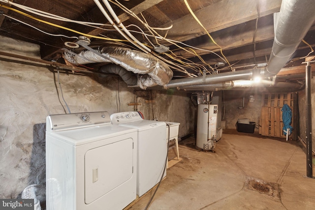 basement with gas water heater and independent washer and dryer