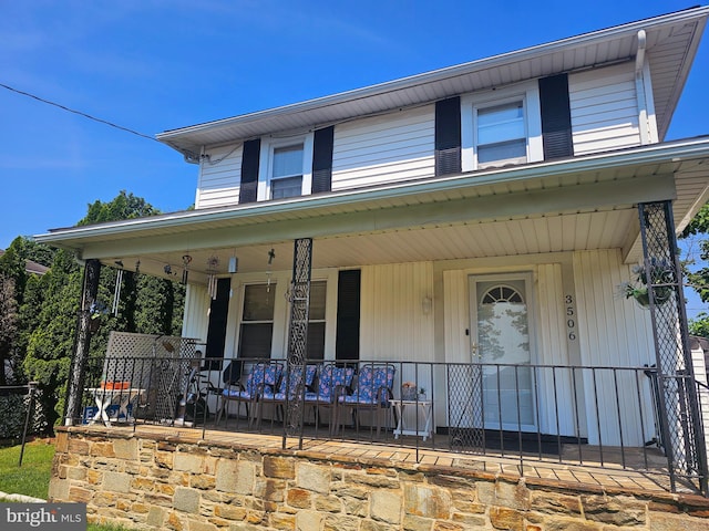 view of front of property featuring covered porch