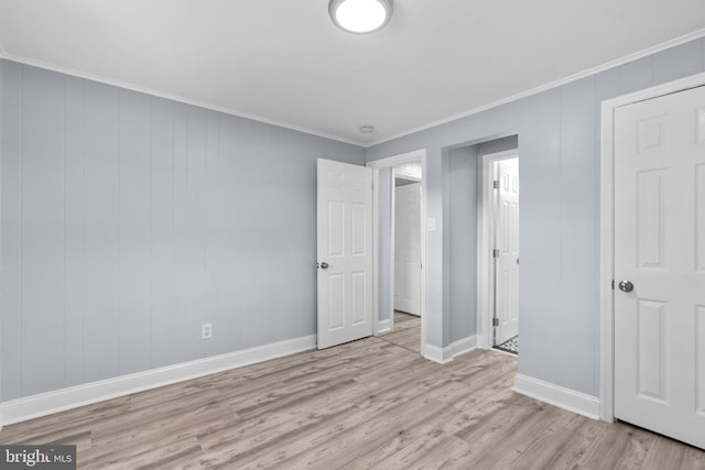 unfurnished bedroom with light hardwood / wood-style floors and crown molding