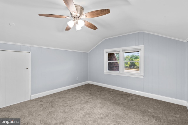 additional living space featuring ceiling fan, carpet, and lofted ceiling