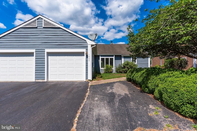 ranch-style home featuring a garage