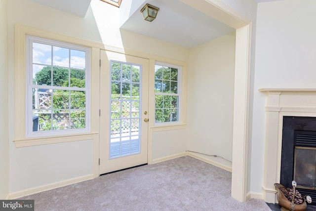 doorway with light carpet