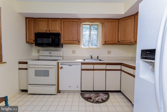 kitchen with white appliances and sink