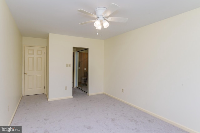 unfurnished bedroom featuring ceiling fan and light colored carpet