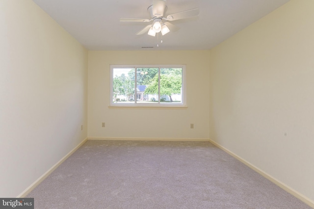 carpeted empty room with ceiling fan