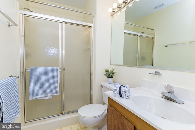 bathroom with vanity, toilet, and walk in shower