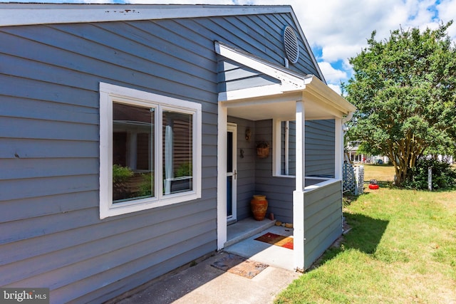 property entrance with a yard