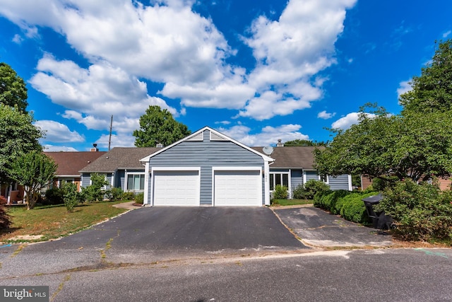 single story home with a garage