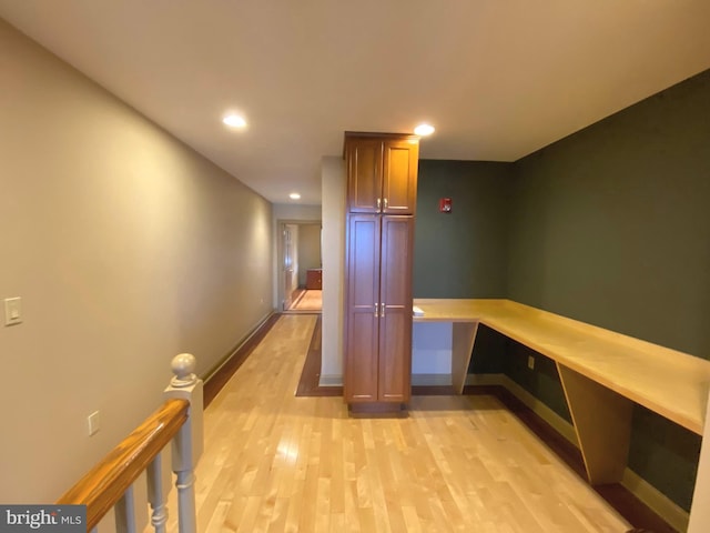 corridor with light hardwood / wood-style flooring