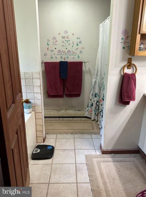 bathroom featuring tile patterned flooring and a baseboard radiator