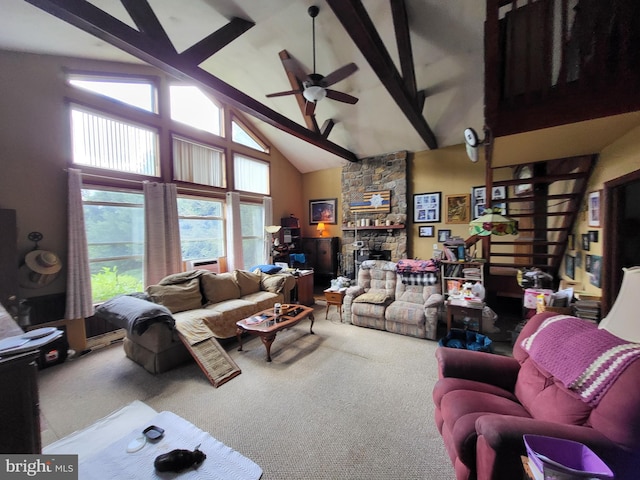 carpeted living room featuring a fireplace, high vaulted ceiling, ceiling fan, and beamed ceiling