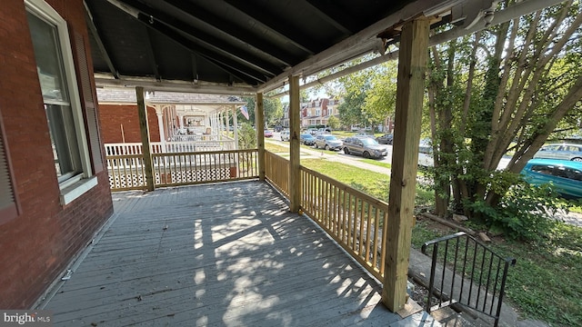 wooden deck featuring a porch