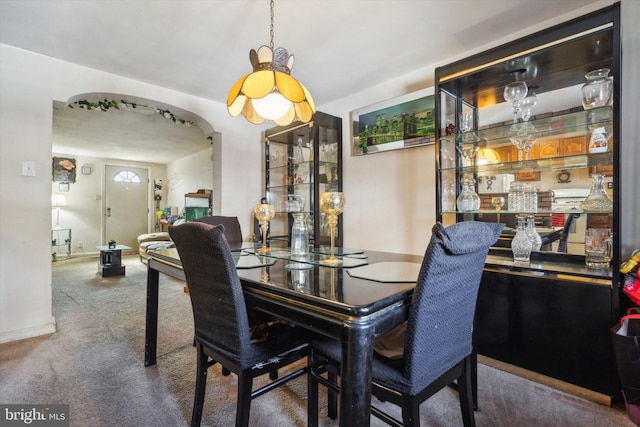 view of carpeted dining space