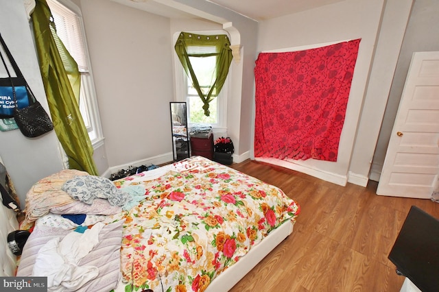 bedroom featuring wood-type flooring