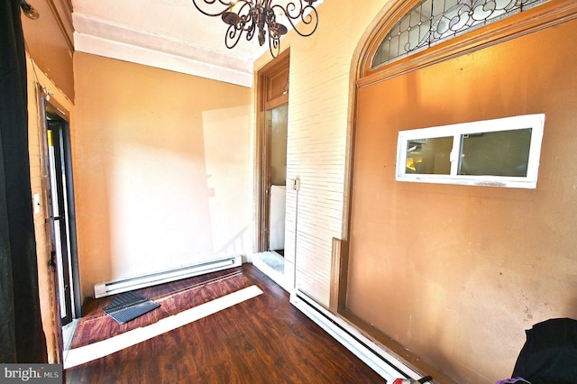 entrance to property featuring a baseboard heating unit