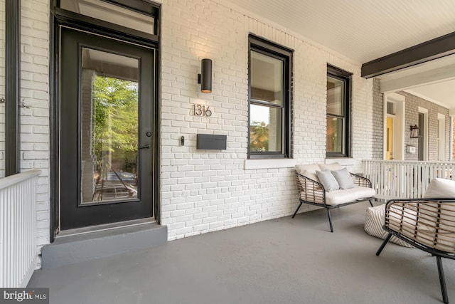 entrance to property featuring covered porch